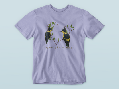 lavender t-shirt with bird design and text on a light blue background