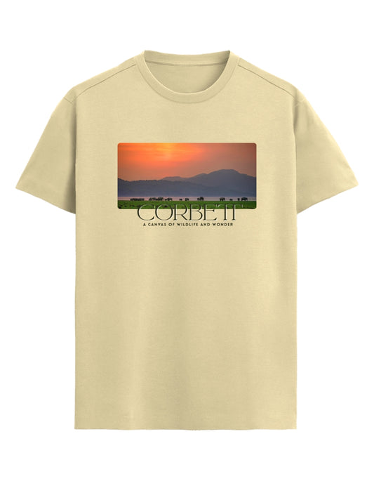 Beige t-shirt with a graphic of a sunset over mountains and the brand name 'Corbett' on a white background.