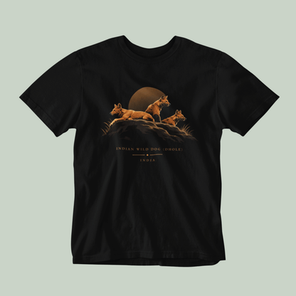 Dhole wildlife Black T-shirt featuring three Indian wild dogs on a rocky landscape with sunset-inspired artwork