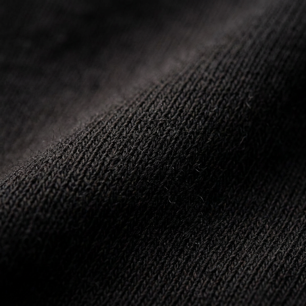Fabric texture close-up – premium black cotton jersey