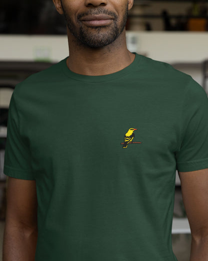 Person wearing a green tucktribe t-shirt with a small embroidery of a golden oriole on  the chest.