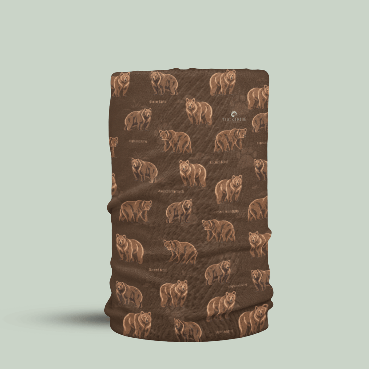 A brown neck gaiter or face mask featuring a repeating pattern of brown bears and small text, shown on a light sage green background.