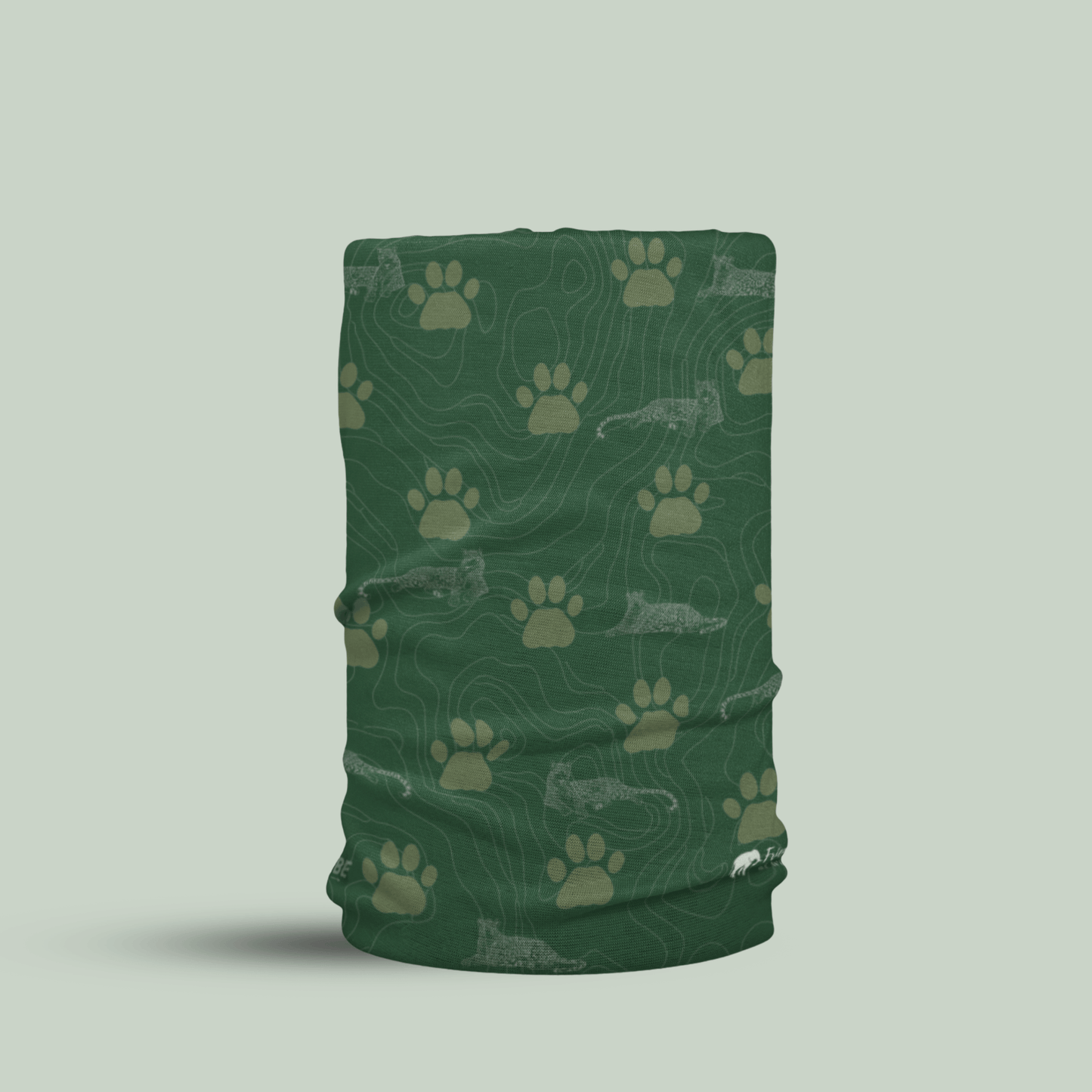 Green Tucktribe neck gaiter with leopard paw print pattern  on a light gray background