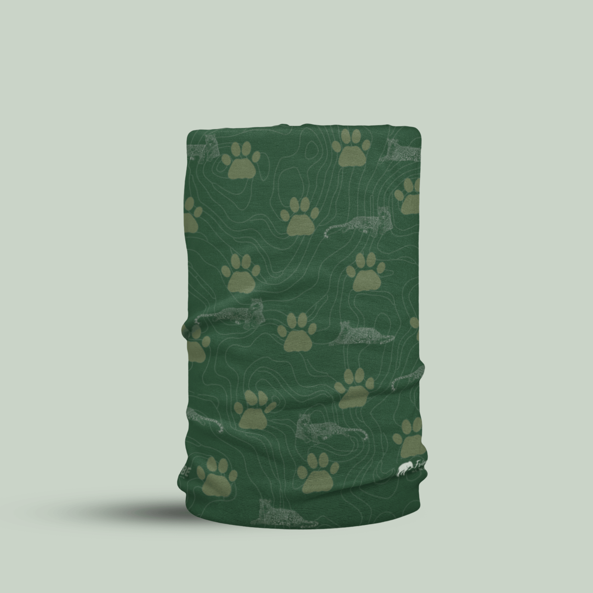 Green Tucktribe neck gaiter with leopard paw print pattern  on a light gray background