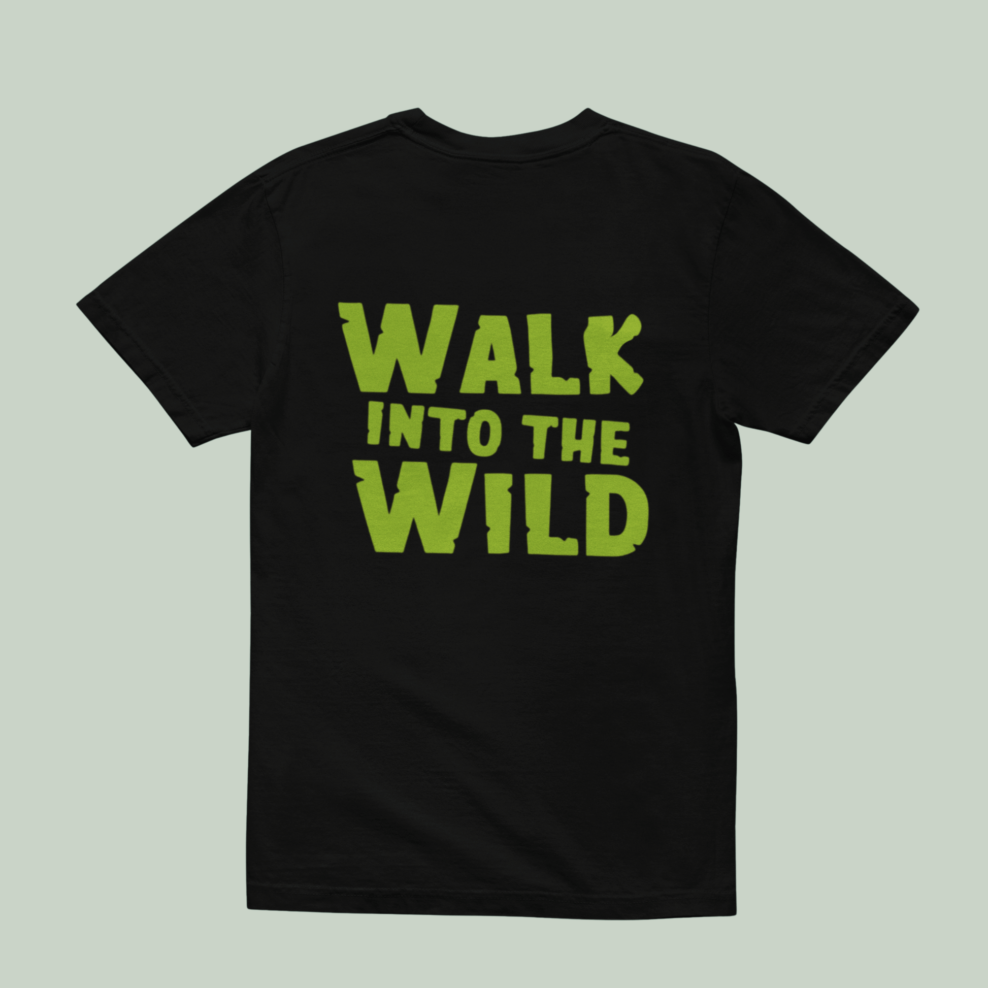 back view of Black t-shirt with 'WALK INTO THE WILD' text in green on a light green background