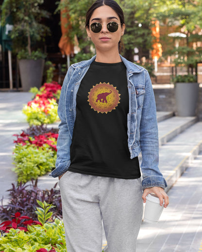 woman wearing a black tucktribe t-shirt with a colorful mandala elephant design outdoor