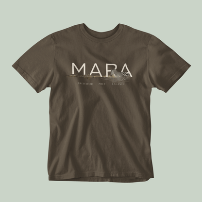 A Olive green Tucktribe short-sleeve crewneck t-shirt with a beige graphic print on the chest featuring the word 'MARA' and smaller text 'PREDATOR - PREY- BALANCE' with a Zebra and crocodile illustration, displayed against a solid light sage green background.