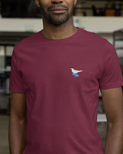man wearing maroon  Supima cotton t-shirt with embroidered River Tern bird design by Tucktribe