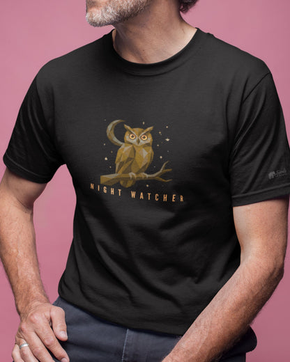 Person wearing a black tucktribe t-shirt with an owl graphic and 'Night Watcher' text on a pink background