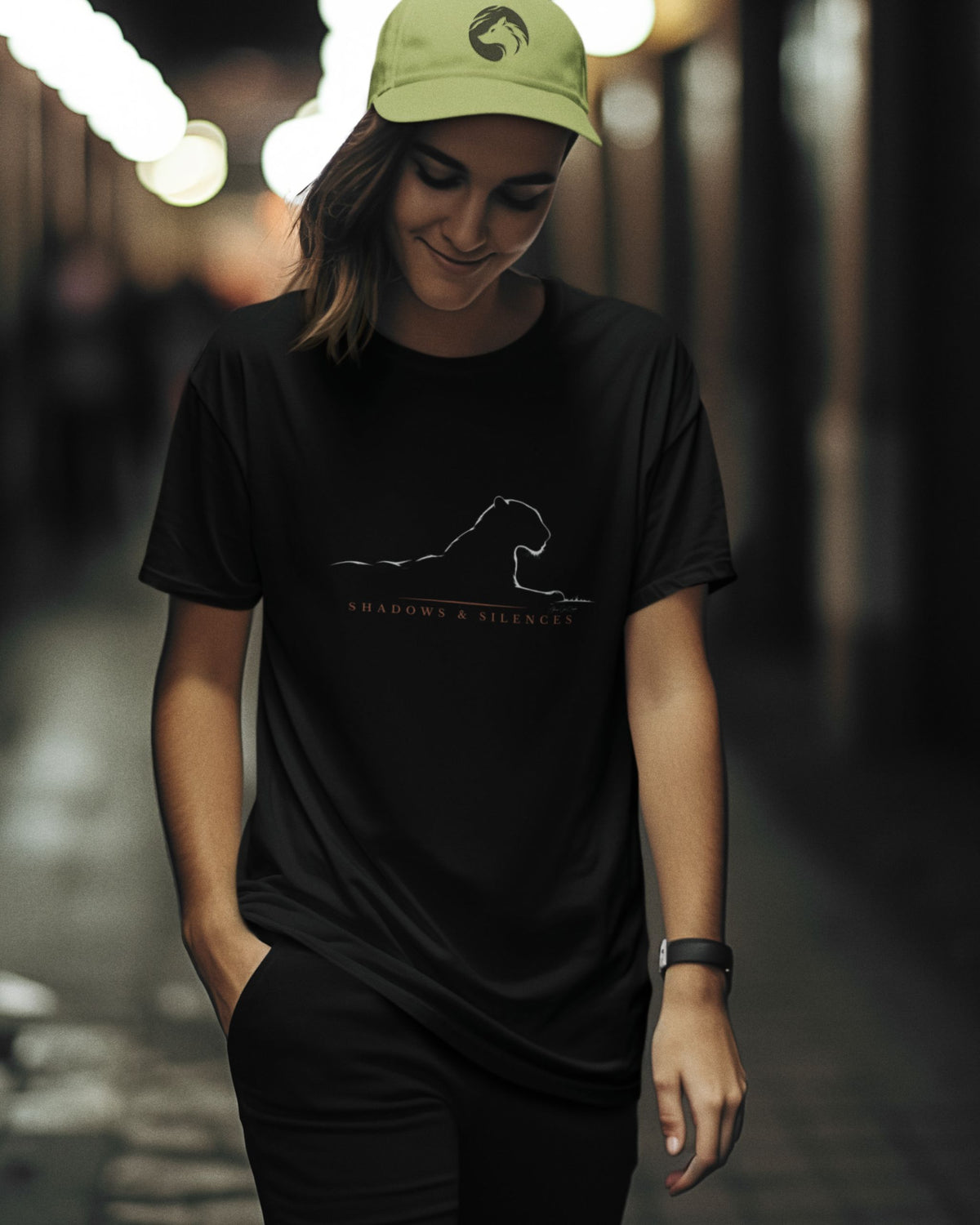 woman wearing a Black Jawai leopard T-shirt with minimalist Shadows and Silences wildlife graphic 