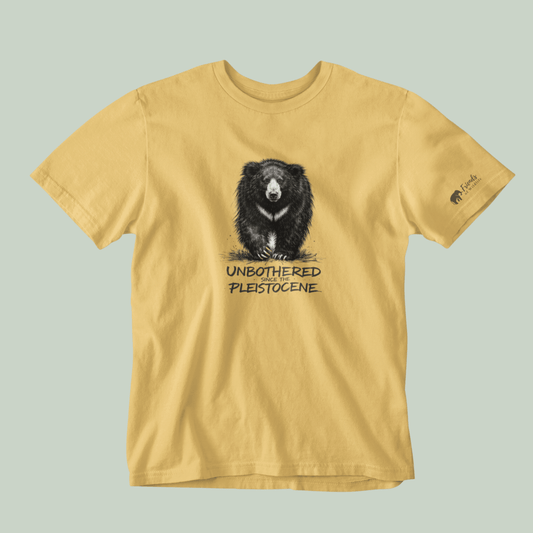 Beige t-shirt with a bear graphic and text on a light gray background