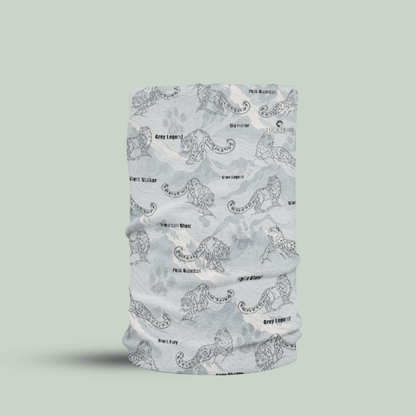 A light gray tubular neck gaiter with a black line-art pattern of snowleopards and the words 'snow legend' and 'Grey Legend', shown on a solid sage green background.