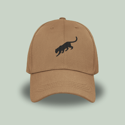 khaki tan tucktribe cap with a black panther logo on a light green background
