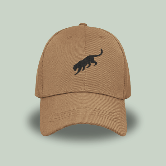 khaki tan tucktribe cap with a black panther logo on a light green background