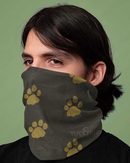 Person wearing a Deep green Tucktribe neck gaitor which has paw prints of a male and female tiger.