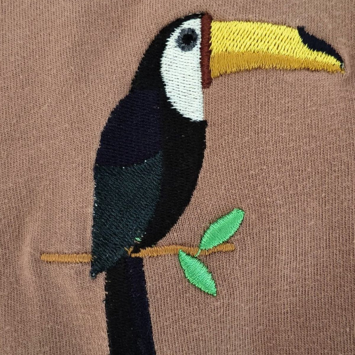 Close-up of premium wildlife embroidery on Tucktribe t-shirt, inspired by nature and crafted in India