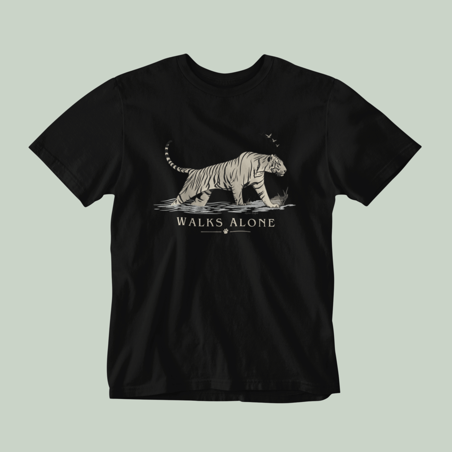 Black unisex tiger T-shirt with minimalist vintage wildlife artwork and “Walks Alone” design